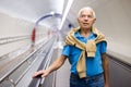 Retired man walking down the escalator to metro station Royalty Free Stock Photo