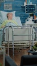 Retired patient with disease sitting in hospital bed Royalty Free Stock Photo
