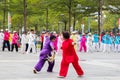 Retired people are practicing martial art dance in street