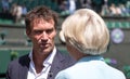 Retired player Pat Cash being interviewed by Sue Barker on centre court before the start of the men`s finals. Royalty Free Stock Photo