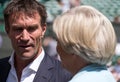 Retired player Pat Cash being interviewed by Sue Barker on centre court before the start of the men`s finals. Royalty Free Stock Photo