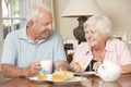 Retired Senior Couple Enjoying Afternoon Tea Together At Home Royalty Free Stock Photo