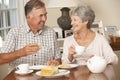 Retired Senior Couple Enjoying Afternoon Tea Together At Home Royalty Free Stock Photo