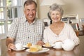 Retired Senior Couple Enjoying Afternoon Tea Together At Home Royalty Free Stock Photo