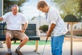 Retired senior couple playing mini golf together Royalty Free Stock Photo