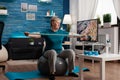 Retired senior man sitting on fitness swiss ball in living room doing wellness fitness workout Royalty Free Stock Photo