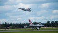 The retired Swedish J35 Draken take off and the taxing Danish F16 Fighting Falcon