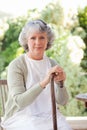 Retired woman with her walking stick Royalty Free Stock Photo