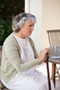 Retired woman with her walking stick Royalty Free Stock Photo