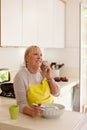 Retired woman preparing food at home Royalty Free Stock Photo
