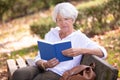 retired woman reading book Royalty Free Stock Photo