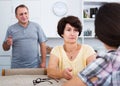 Retiree couple talking with daughter