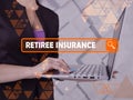 RETIREE INSURANCE phrase on the screen. Bookkeeping clerk use internet technologies at office. Concept search and RETIREE Royalty Free Stock Photo