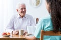 Retiree and nurse reading book