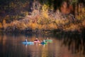 A group of kayakers enjoying the autumn colors.