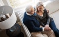 Retirement brings everlasting days of comfort. a loving mature couple relaxing together at home.