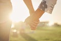 Retirement, couple and hands with sun closeup of married man and woman on field for summer walk. Support, care and trust Royalty Free Stock Photo