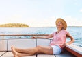 During retirement, do whatever floats your boat. a mature woman enjoying a relaxing boat ride.