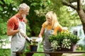 Retirement Hobbies. Happy Senior Couple Gardening Together On Backyard Royalty Free Stock Photo