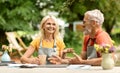 Retirement Leisure. Happy Senior Couple Drinking Tea Together Outdoors Royalty Free Stock Photo