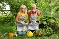 Retirement Leisure. Happy Senior Couple Gardening Together In Backyard Royalty Free Stock Photo