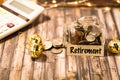 Retirement money jar savings motivational concept on wooden board Royalty Free Stock Photo