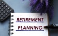 RETIREMENT PLANNING - words are written on a notepad with a marker, calculator and lavender sprigs Royalty Free Stock Photo