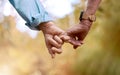 Retirement, senior couple and holding hands for love, romance and bonding together. Romantic, hand gesture and loving