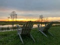 retirement and two chairs looking at the sunset in the swamp Royalty Free Stock Photo