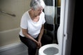 Retirement woman fell down in a restroom