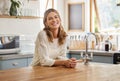 Retirement woman and relax in kitchen portrait with attractive and happy smile resting in house. Senior, elderly and