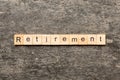 retirement word written on wood block. retirement text on cement table for your desing, concept Royalty Free Stock Photo
