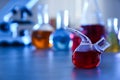 Retort flask on table against blurred background.  Chemistry glassware Royalty Free Stock Photo