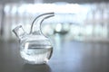 Retort flask with water on table