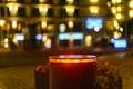 A retractable bollard with a red warning light as a barrier to a pedestrian area at night in Bansin, Germany.