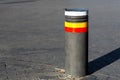 Retractable bollards on paving slabs.