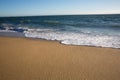 Retreating water on a beach