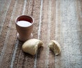 A bowl of wine and bread on the table. Communion symbols