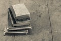 Retro aged books on oak wooden table. Vintage style sepia photo