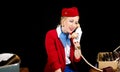 Retro Airline Stewardess Preparing for Work and Talking on the T