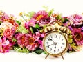 Retro alarm clock with flowers on white background Royalty Free Stock Photo