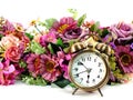 Retro alarm clock with flowers on white background Royalty Free Stock Photo