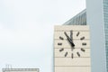 Retro-style alarm clock showing five minutes to twelve Royalty Free Stock Photo
