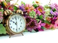 Retro alarm clock with flowers on white background Royalty Free Stock Photo