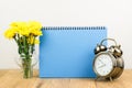 Retro alarm clock and flowers Royalty Free Stock Photo