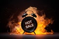 Retro alarm clock with hot sale message burning on black background. Black friday sale theme. Alarm clock in fire, time out or Royalty Free Stock Photo