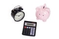 Retro alarm clock, piggy bank and calculator Royalty Free Stock Photo