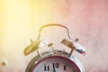 Retro alarm clock on a red white background close-up, toning Royalty Free Stock Photo