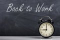 Retro alarm clock and text `Back to Work` Royalty Free Stock Photo