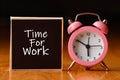 Retro alarm clock and the text `time for work `. Royalty Free Stock Photo